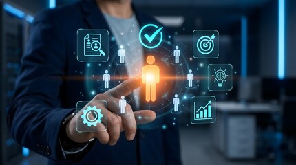 Fototapeta premium Businessman in a dark office interacting with a futuristic digital interface for human resources management and talent acquisition recruitment process