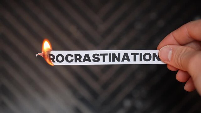 Burning &ldquo;PROCRASTINATION&rdquo; concept symbolizing action, discipline, focus, productivity, and breaking delay habits to move forward with goals and momentum.