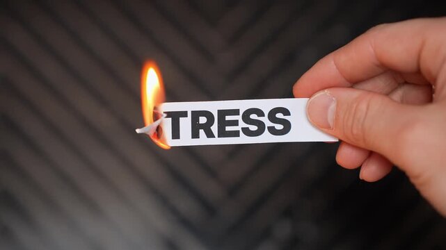Burning &ldquo;STRESS&rdquo; concept symbolizing calm, emotional release, mental clarity, relaxation, and freedom from pressure, anxiety, overwhelm, and daily tension.