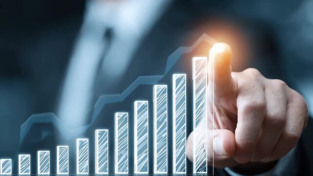 Businessman pointing at a growth chart in a modern office setting, illustrating success and strategy in the finance sector