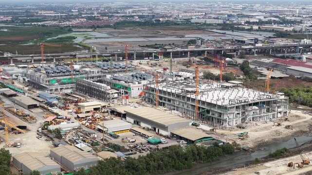 Aerial drone video of massive hyperscale data center construction near Bangkok, Thailand, featuring AI technology, cloud computing infrastructure, and rapid digital expansion.