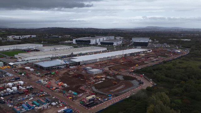 Aerial view of Vantage data center campus expansion and construction in Cardiff at dusk, showcasing massive hyperscale infrastructure, cloud computing growth, and advanced digital technology developme