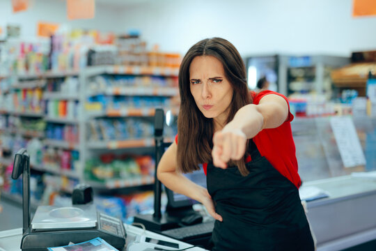 Angry Supermarket Cashier Pointing her Finger to the Door. Furious employee arguing with clients in a retail grocery store in difficult customer service interaction
