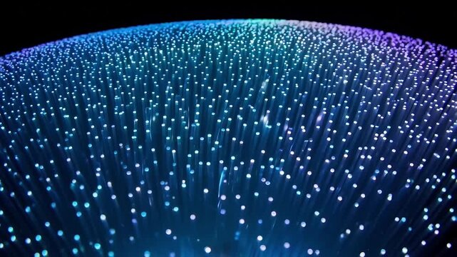 A glowing blue and purple light installation inside a futuristic LED dome creates a digital art display and technology-inspired background