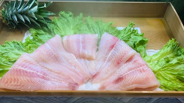 Dory fish fillets that have been cleaned are ready to be cooked. Fresh filleted fish.