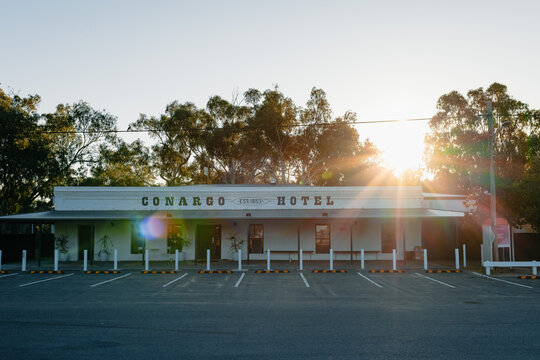 Conargo Hotel established 1853 at sunset with sun flares and empty car park