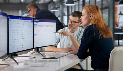 Obraz premium Sales Manager Analyzes Automated Sales Dashboard