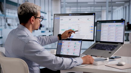 Fototapeta na wymiar ERP Expert Evaluates Cloud-Based Integrated Management Software On Laptop