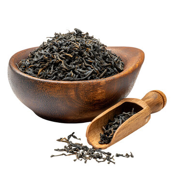 Loose leaf tea in wooden bowl with scoop on white background