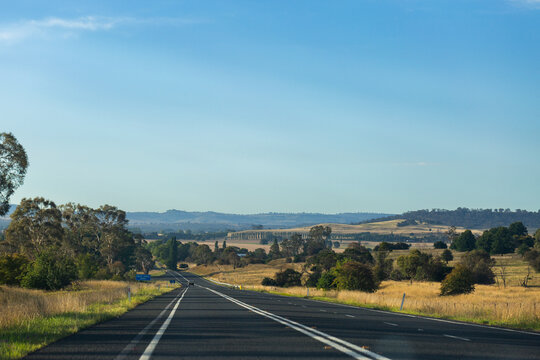 open highway road ahead through Australian countryside landscape