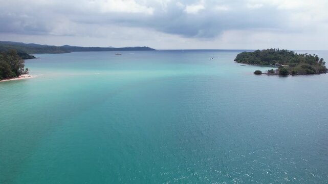 Lush Island Of Ko Raet Surrounded By Turquoise Waters Near Koh Kood In Trat, Thailand. wide drone shot