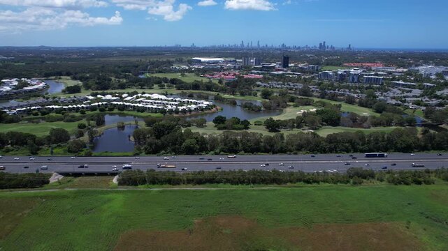 Traffic Over Pacific Motorway Near Firth Park In Mudgeeraba On The Gold Coast In Queensland, Australia. Aerial Shot
