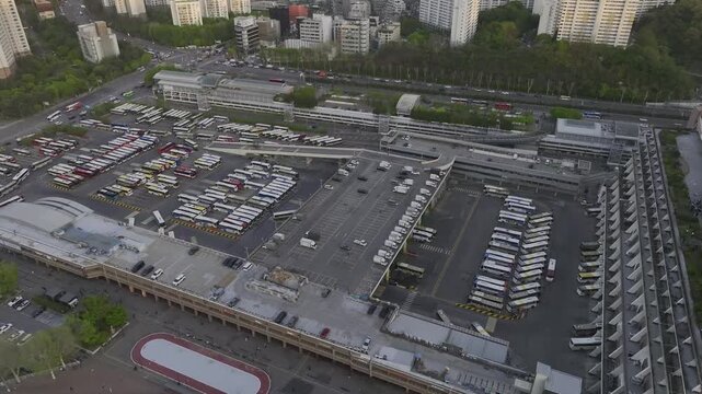 Aerial view of Seoul Express Bus Terminal at sunset with heavy traffic and city lights, Gangnam, South Korea.