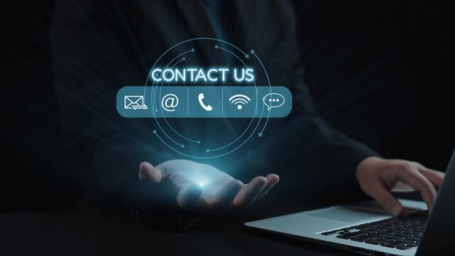 A businessman reaches out with a glowing "Contact Us" interface above his hand, showcasing the importance of modern communication and customer engagement in business. Qubit