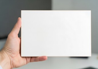 Obraz premium Hand holding blank white sign board for text mockup
