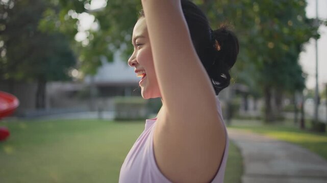 Asia young Gen Z people mindful happy woman open arm relax body deep stress relief outdoor nature green public park sun light self love anti aging life asian female mental health care modern medical.