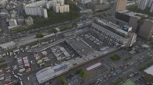 Aerial view of Seoul Express Bus Terminal at sunset with heavy traffic and city lights, Gangnam, South Korea.