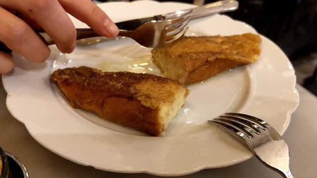 Delicious Spanish torrijas on a white plate evoke tradition and warmth