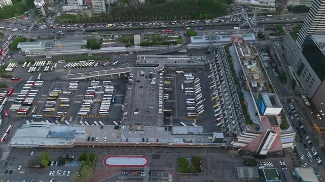 Aerial view of Seoul Express Bus Terminal at sunset with heavy traffic and city lights, Gangnam, South Korea.