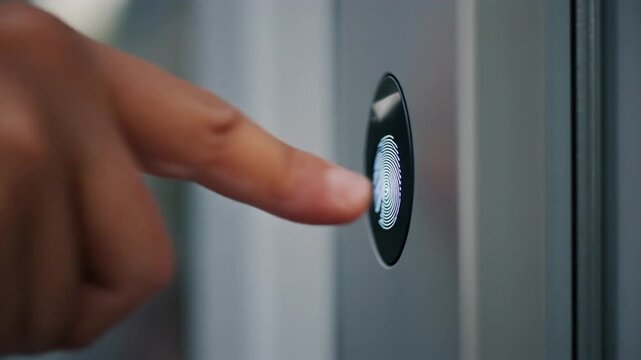 Hand pressing doorbell button closeup.