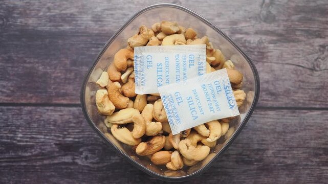Cashews and silica gel packets in a clear container