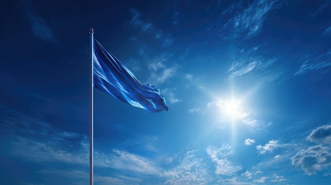 Commercial banner concept Nishan Sahib flag against a deep cerulean sky with light cloud wisps, sun behind the triangular flag creating a solar halo effect, 