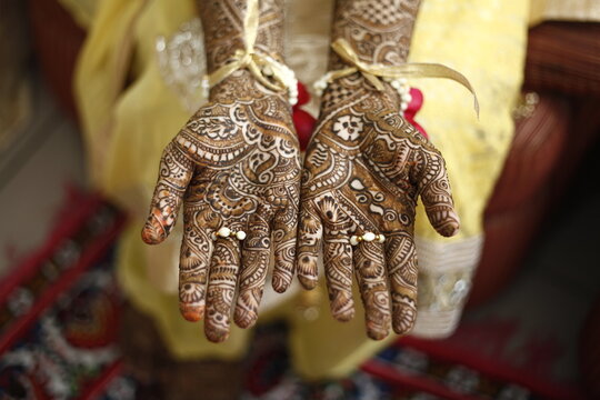 woman in mehendi hands an indian tatoo