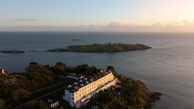 A serene view of Dalkey Island with a historic Martello Tower, captured at sunset from Killiney. Ideal for travel and history-themed projects.