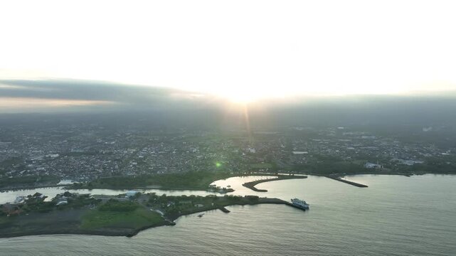 Aerial Drone Dolly In Banyuwangi Coast Indonesia Cityscape Golden Hour Sunrise Coastal City Skyline East Java