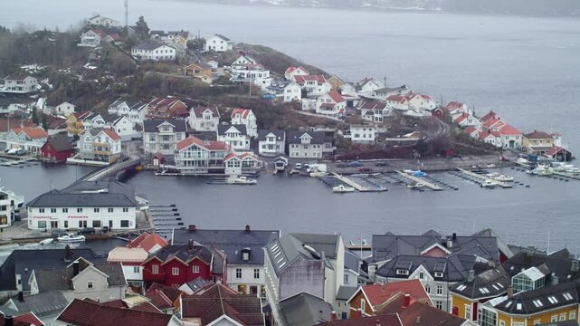 A static panoramic view from the center of Krager&oslash; in Telemark southern Norway, with the &Oslash;ya area in the background, on a cloudy day