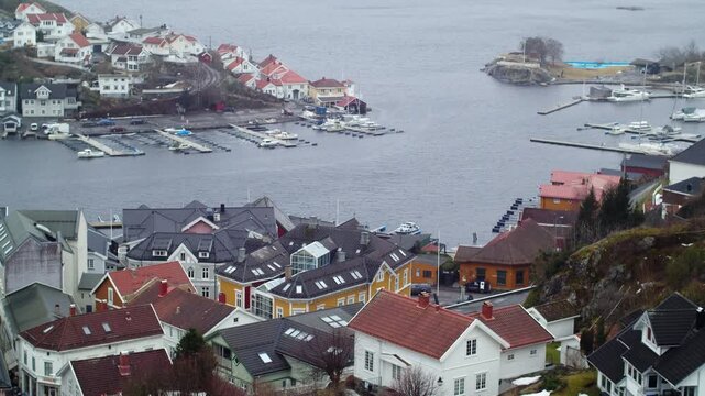 Panoramic view of downtown Krager&oslash;, with wooden houses and yacht docks on the island of &Oslash;ya, in southeastern Norway, cloudy day