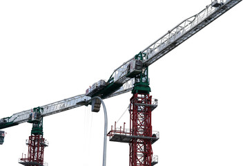 Construction crane with lattice boom towering against a partly cloudy sky highlighting intricate structure engineering detail and industrial strength in an urban setting © Jimmy