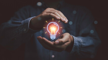 Creative idea innovation concept with glowing lightbulb in hands, symbolizing inspiration, problem...