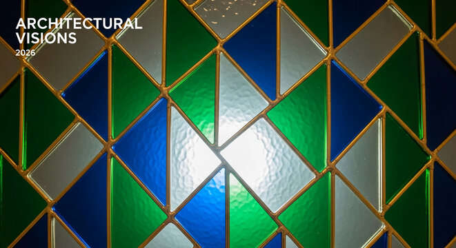 Abstract stained glass with blue, green, silver rhomboid shapes separated by metallic border, showcasing stained glass art and complex geometry