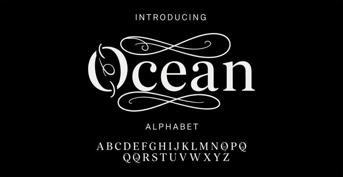 Elegant script ocean alphabet display with decorative swirls