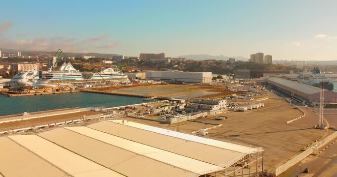 Explore the Great Seaport of Marseille, one of the largest seaports globally, showcasing bustling maritime activity and modern infrastructure.
