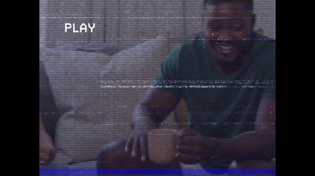 Four friends tapping tablet, starting PLAY overlay with VHS lines, laughing and inspiring designers