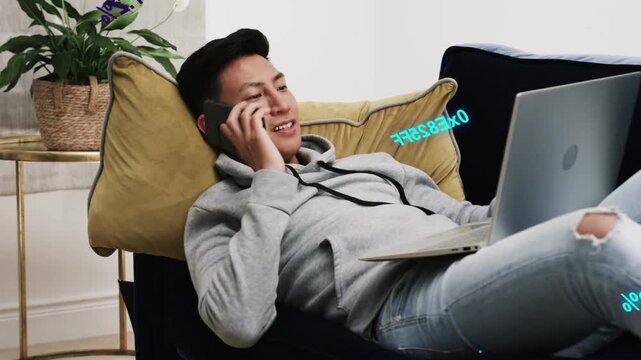 Man reaching phone scrolling then answering call tapping laptop with overlays around devices
