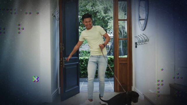 Man pushing open front door with sidelights, entering home bringing dog on leash inside