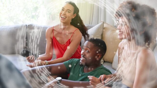 Three friends on sofa reacting to remote tap, generating swirl overlay animation for entertainment