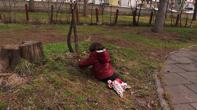 Child practices roller skating alone in a park, showing determination, balance, and early learning. Ideal for themes of childhood development, independence, outdoor activity, and growth mindset.