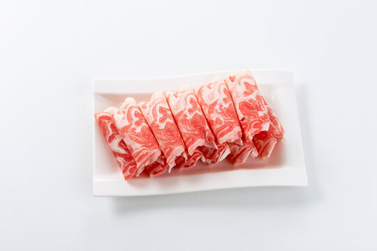 White background image of sliced ​​raw mutton