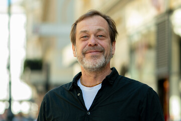 Obraz premium Male portrait in city conveys trust stability and life experience