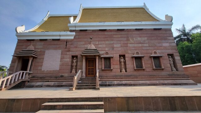 Wat Thai Sarnath temple with golden Thai architecture and Buddha statue near Varanasi, India