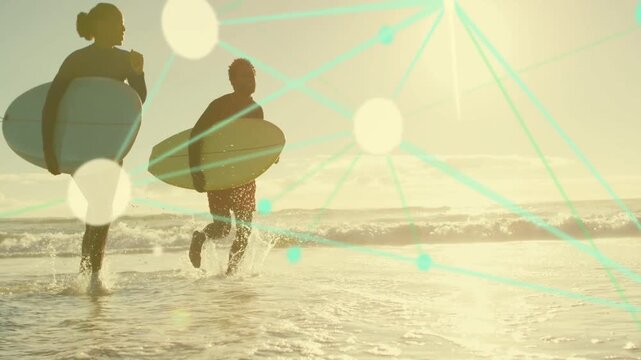 Two surfers running from sand seeing swell to surf, splashing, teal lines tracing boards, sports