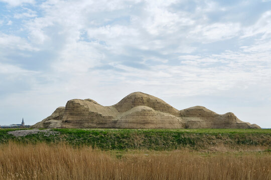 Earth sculpture of a reclining woman in the frisian landscape at the sea dike near Oosterbierum in Friesland The Netherlands