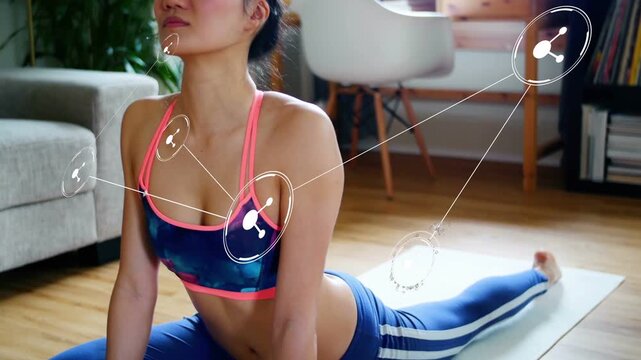Vertical video: Cueing woman lifting into backbend on yoga mat at home, in activewear with overlays