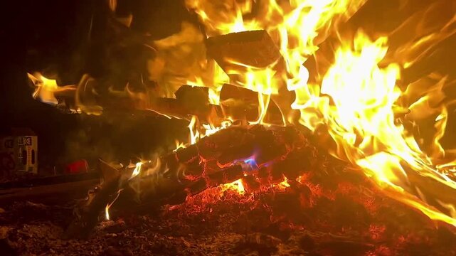 Star shaped fire burning big and bright during the beginning of winter solstice in the cold dark night of Tennessee.