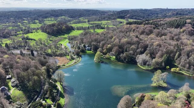 Stourhead landscaped gardens and lake Wiltshire drone aerial reverse reveal