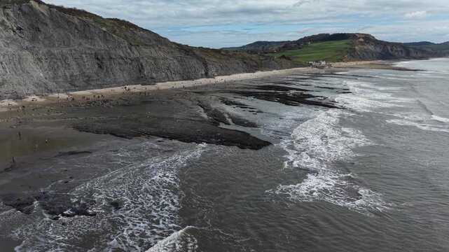 Lyme Regis UK The Spittles cliffs Jurassic Coastline drone aerial low shot 4K